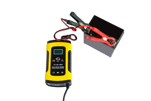 istock Positive negative clamp, red black cable wire to Charging dead battery in breakdown. 1496516843