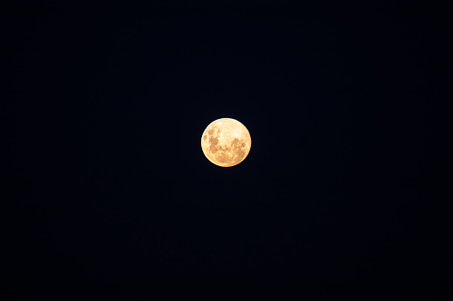 Full moon with a golden glow