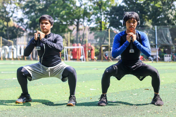 istock Two young man warming up together outdoor 1496531353