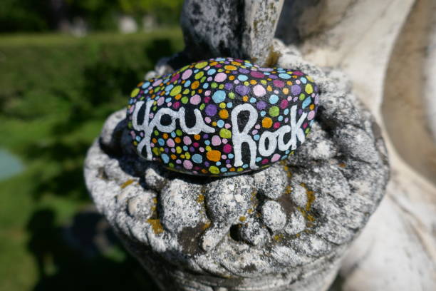 istock Kindness rock on part of old stone statue 1496531366