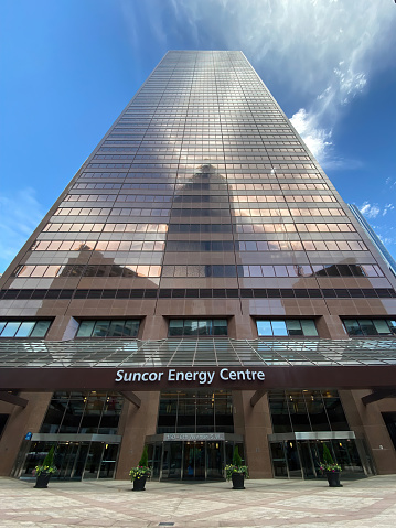 Calgary, Alberta, Canada. Jun 6, 2023. A wide angle vertical view of the Suncor tower building.