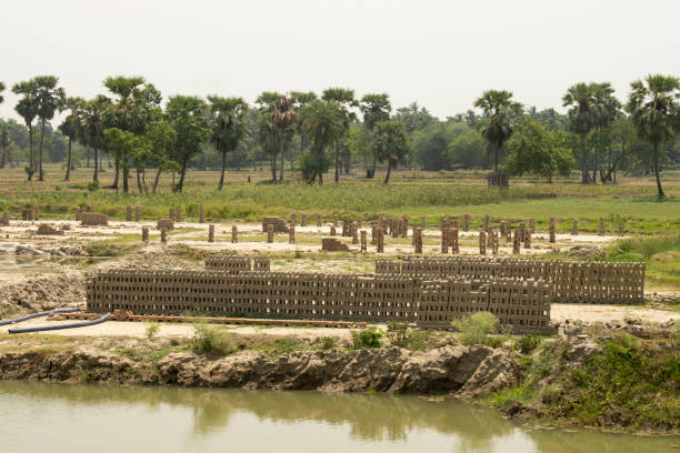 istock sunburned raw brick blocks stacked in pile 1496535440
