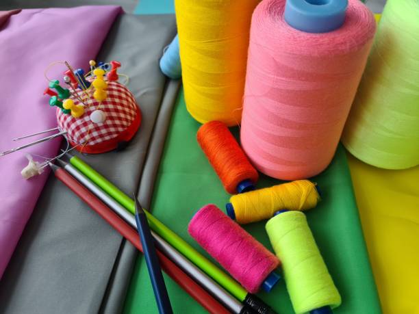 istock Sewing accessories and fabrics and sewing threads and needles 1496535755