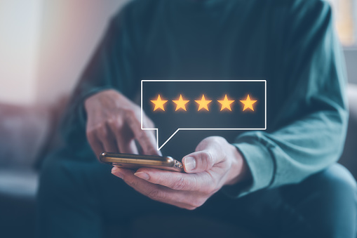customer service survey feedback concept, businessman using smartphone give review and five stars rating to business services