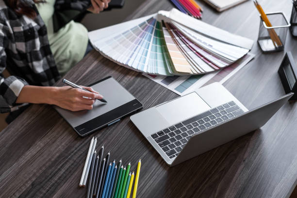 istock Graphic designer working with sketching logo design at office. 1496540816