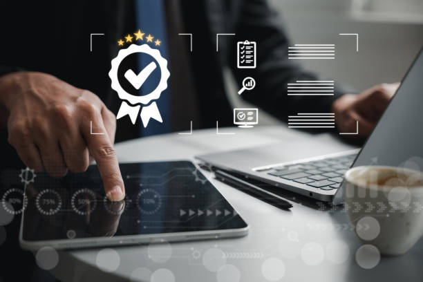 istock Businessman showcasing ISO certification and quality control icon. Assurance of top service and compliance with international standards. Tablet device present to show products and services standards 1496540829
