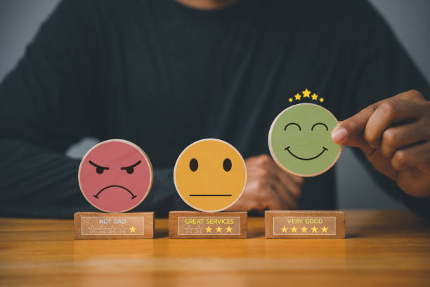 istock Selecting a smiley face on a wooden block circle 1496540849