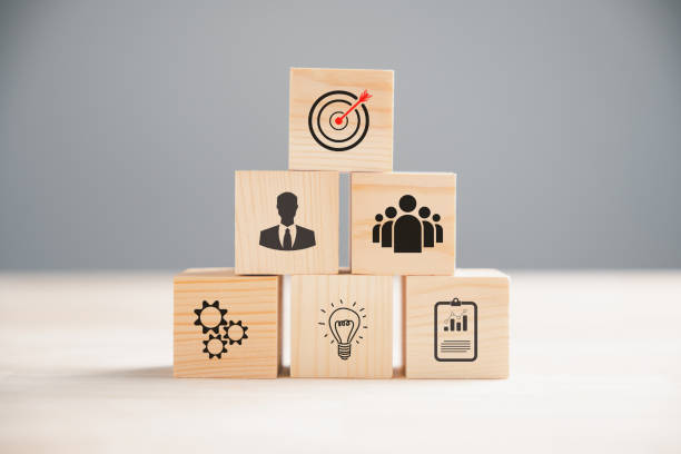 istock Wooden block cude step on table with Action Plan 1496540855
