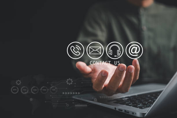 istock Contact us concept with a businessman's hand holding 1496540886