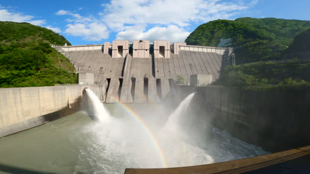 Rainbow over Nagashima Dam releasing water / Shizuoka
