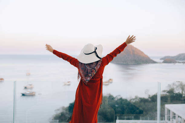 istock Carefree woman enjoying holiday 1496544149