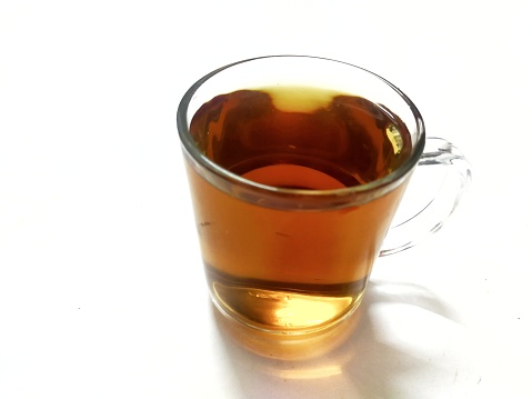 A teabag steeping in hot water