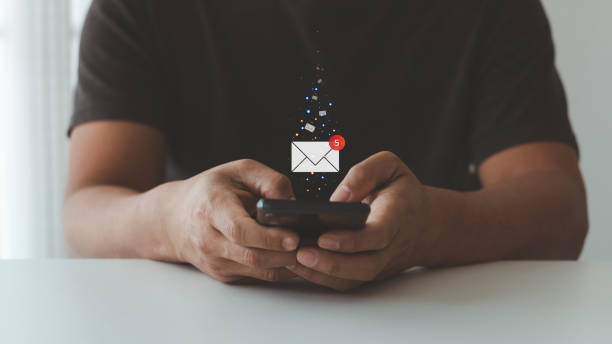 istock email marketing concept, Hand of business people using smartphone for email with notification alert, reading e-mail, receive new message, Online communication concept. 1496548891