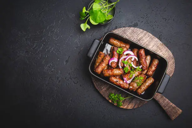 Traditional south european skinless sausages cevapcici made of ground meat and spices
