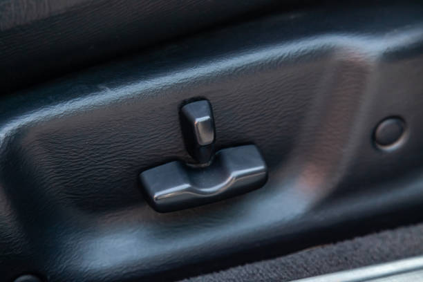 istock Buttons for adjusting the seat horizontally in height by tilting backrest with black leather upholstery in the car after cleaning and detailing in the vehicle repair workshop. Auto service industry. 1496554226