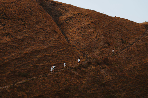 Group of people hiking the mountain hill