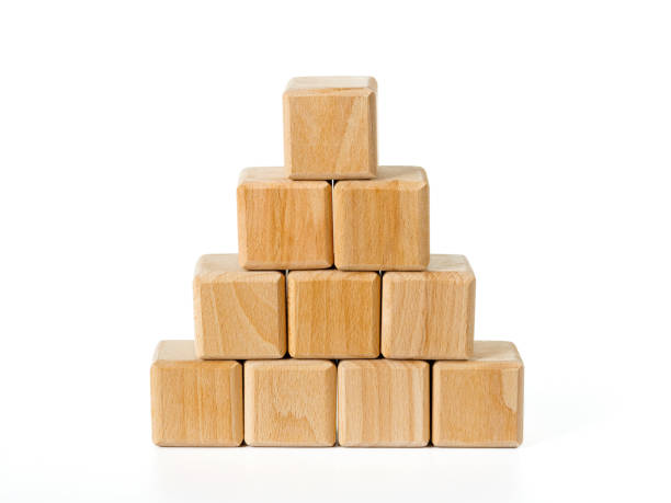 istock Stacking wooden cubes as pyramid as business growth concept 1496556872