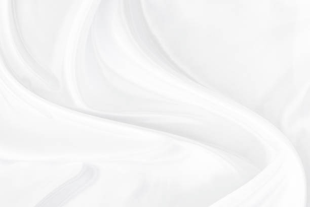 istock White gray satin texture that is white silver fabric silk background with beautiful soft blur pattern natural. 1496559235