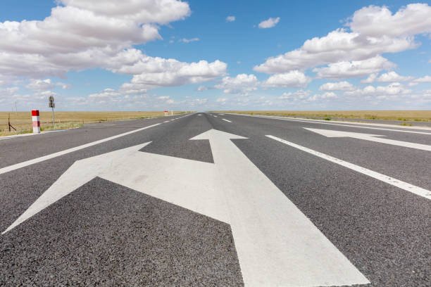 istock Arrow sign on the road 1496559848