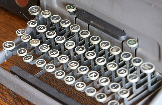 Old retro typewriter keyboard on desk