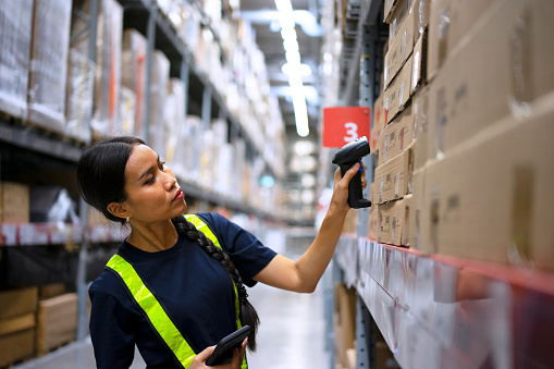 Employee check merchandise at warehouse. Occupation and warehouse concept.