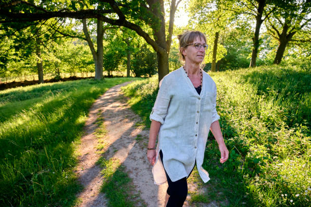 Free Stock Photo of Woman walking on a pathway in sunlight | Download ...