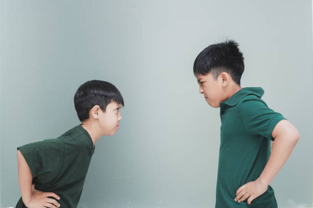 istock Two young boys screaming and fighting and clashing violently 1496562118