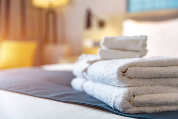Clean towels on bed at hotel room