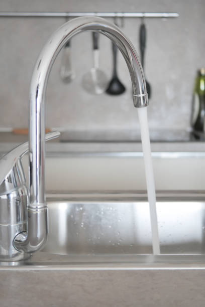 istock water pouring from a faucet tap slow motion 1496567059