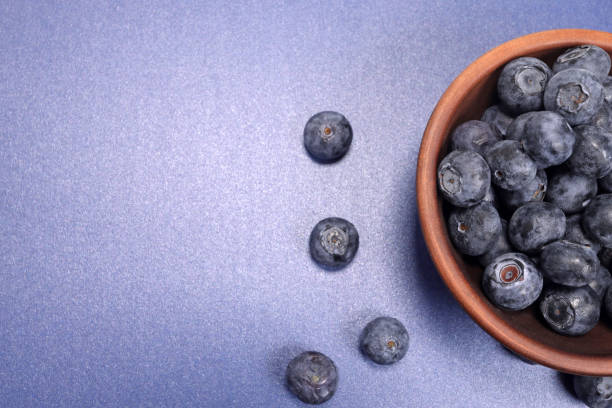 istock Ripe blueberry in a bowl, top view 1496567961