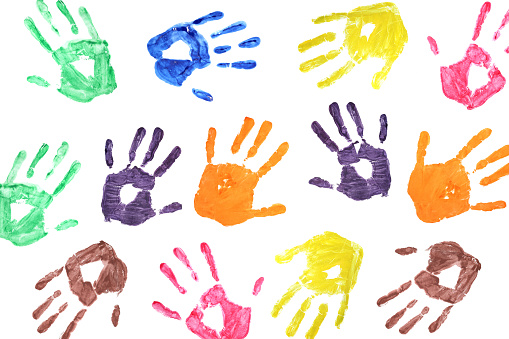 background of colorful children's handprints