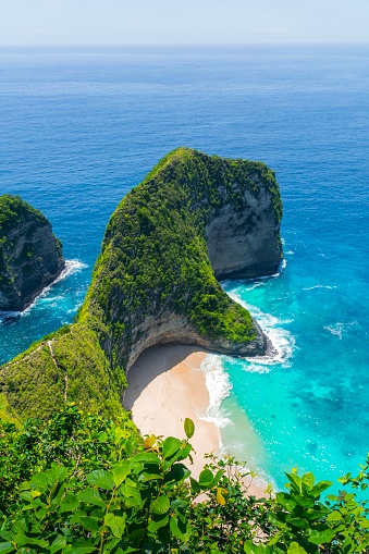 A top view of Kelingking beach at Nusa Penida, Bali, Indonesia. With clear seas and green mountains