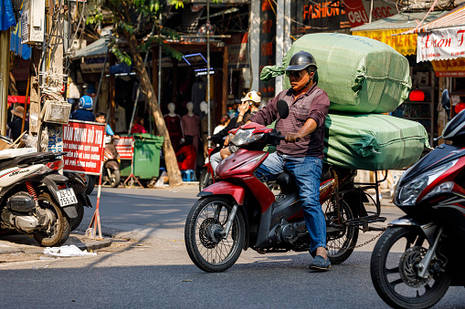 Hanoi, Bac Bo, Vietnam - November 25, 2019: Transport of barrels in the streets of Hanoi