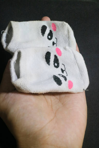 istock Cute baby socks with panda faces 1496572372
