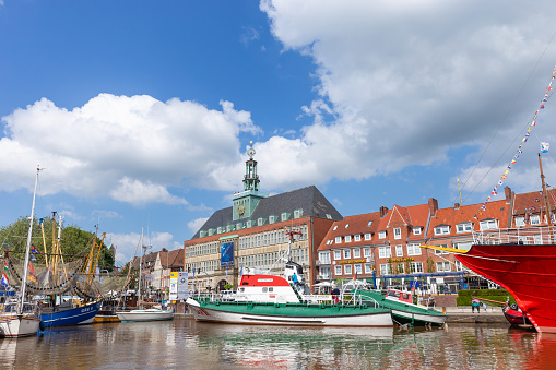 Svaneke, Denmark - August 14, 2015: Tourists enjoy the sunny weather and walking along the quay at the port.