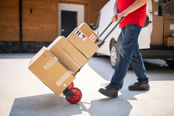 istock Senior male courier delivering at the receiver address. 1496576854