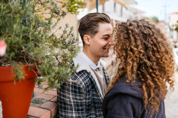 istock Young Couple Embracing On The Streets In Greece 1496581931