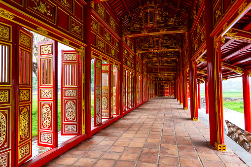 Corridor and red doors in the Forbidden Purple City of The Imperial City of Hue, Vietnam. Inside Forbidden Purple City, Hue, Vietnam.