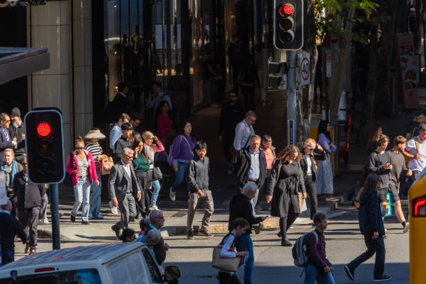 istock Crowd of commuters crossing a CBD street 1496584814