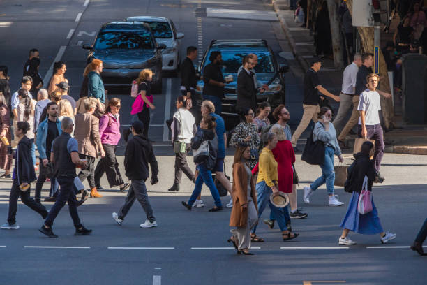 istock Crowd of commuters crossing a CBD street 1496584815