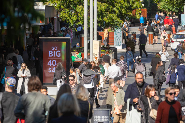 istock Crowd of commuters crossing a CBD street 1496584821