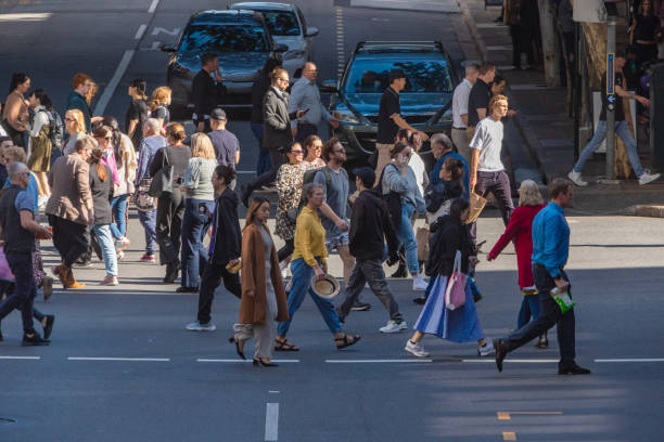 istock Crowd of commuters crossing a CBD street 1496584822