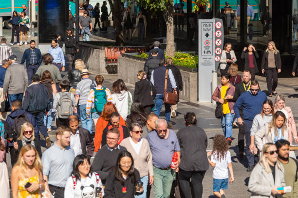 istock Crowd of commuters crossing a CBD street 1496584827