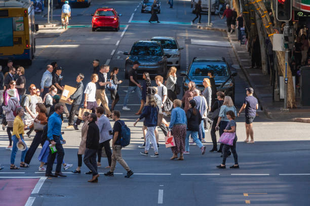 istock Crowd of commuters crossing a CBD street 1496584832