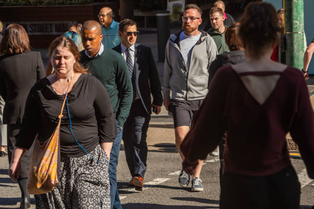 istock Crowd of commuters crossing a CBD street 1496584836