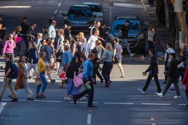 istock Crowd of commuters crossing a CBD street 1496584837
