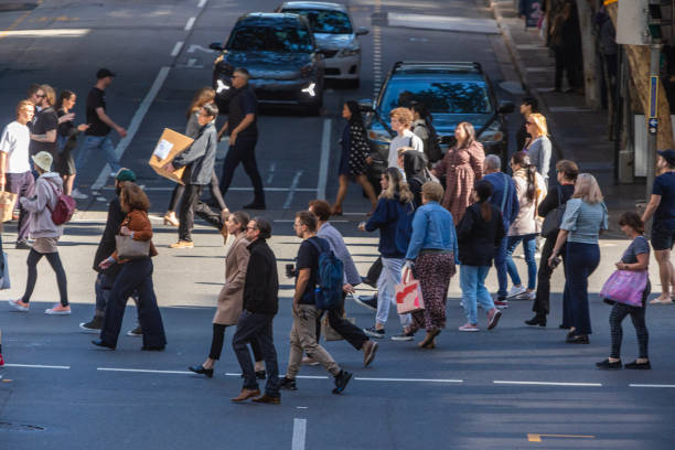istock Crowd of commuters crossing a CBD street 1496584842