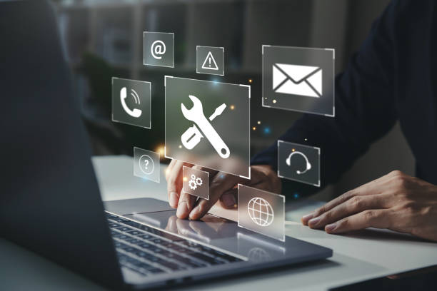 istock Businessman using laptop with helpdesk icon on screen. 1496585495