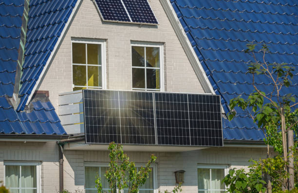 olar panel in modern balcony of residential home with sunlight reflection. Balcony solar power station eco-friendly to use renewable energy. Solar power plant on a balcony to generate green energy .