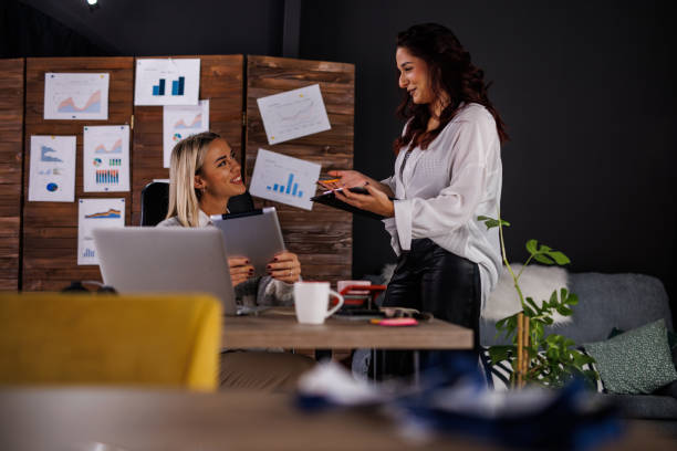istock Colleagues co-working on a project, reviewing data and discussing plans and options 1496590702